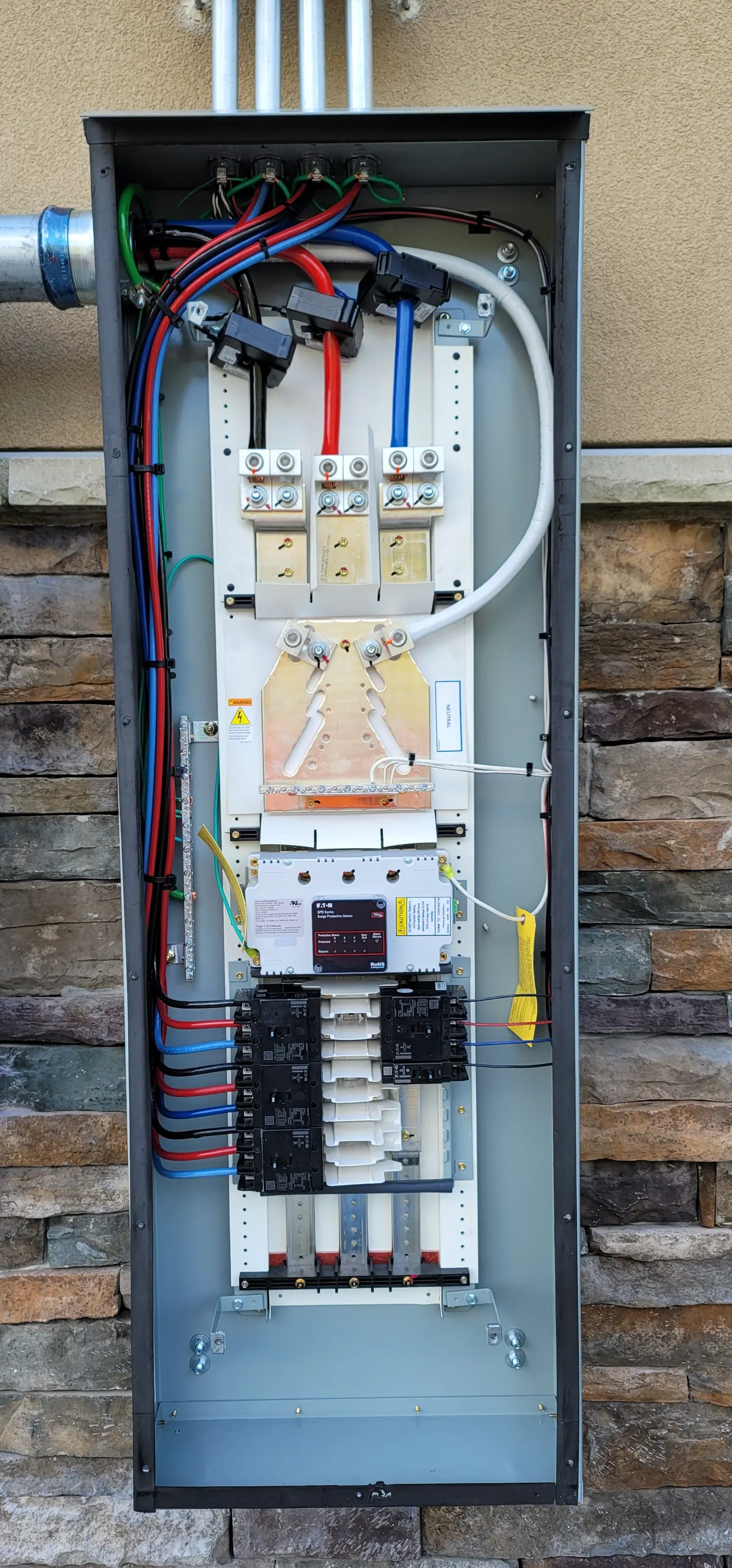Commercial electrical disconnect panel with surge protection and organized wiring