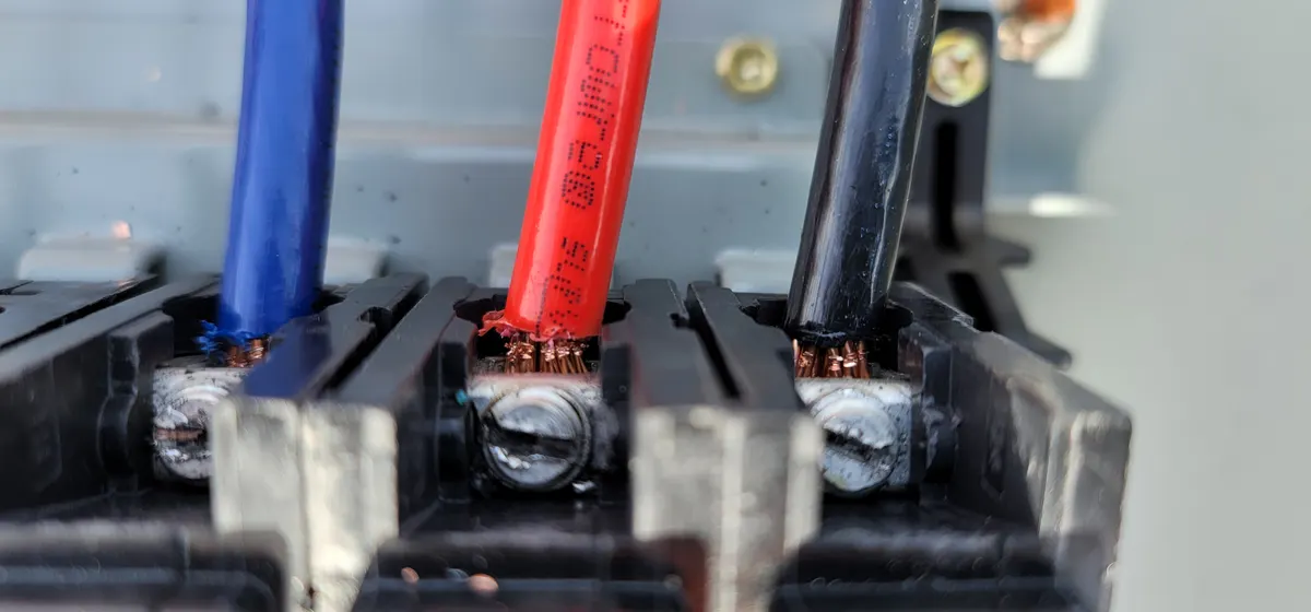 Close-up inspection of electrical conductor connections at a solar disconnect