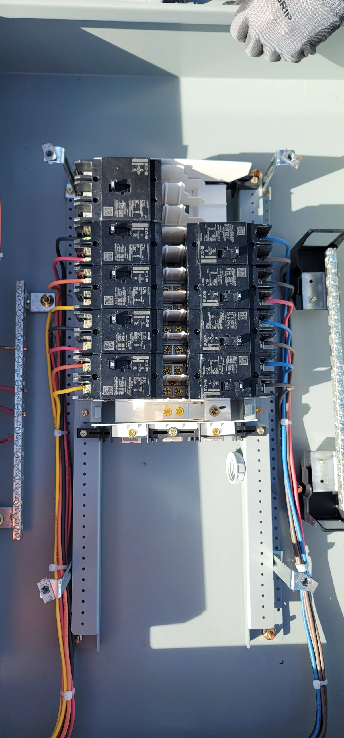 Solar panelboard breaker installation with clean wire management