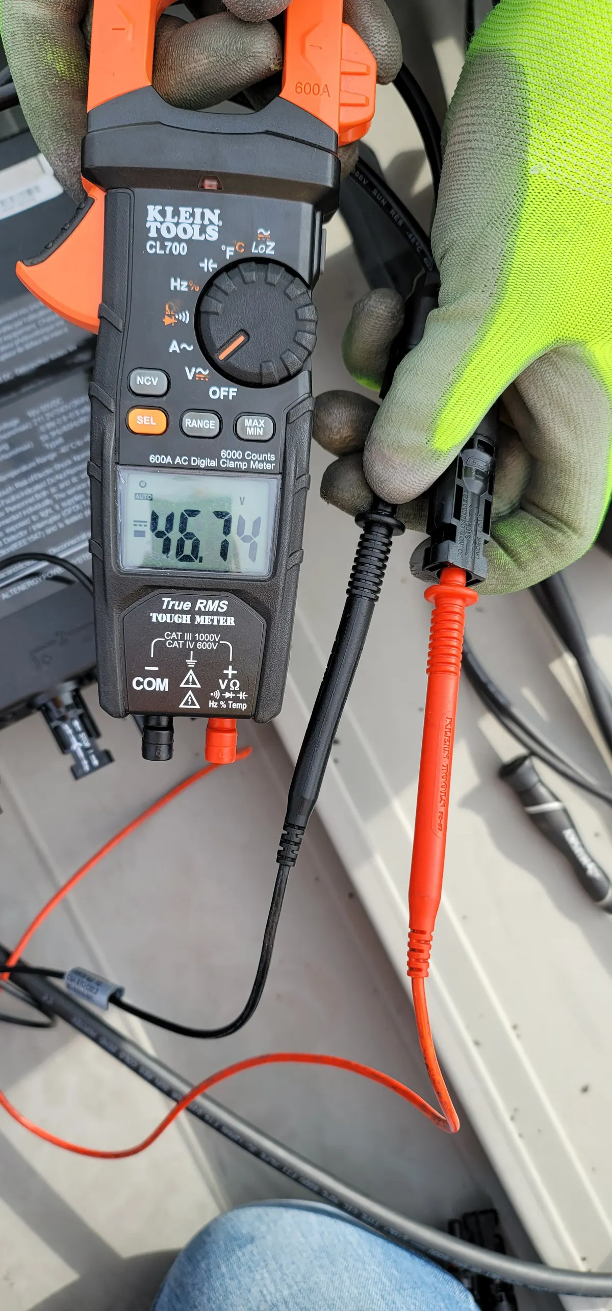 Solar string voltage measured with a clamp multimeter while troubleshooting