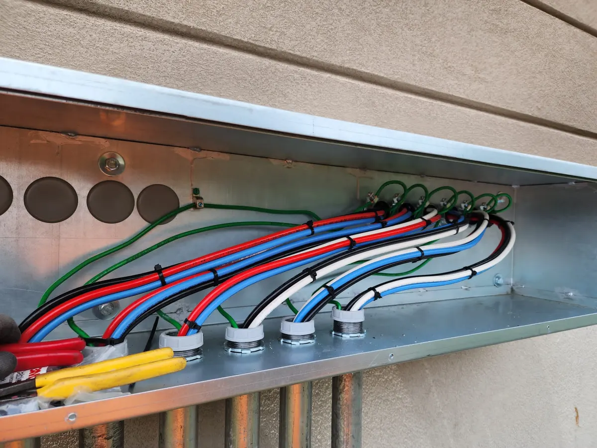 Solar wireway gutter with color-coded conductors and clean cable management
