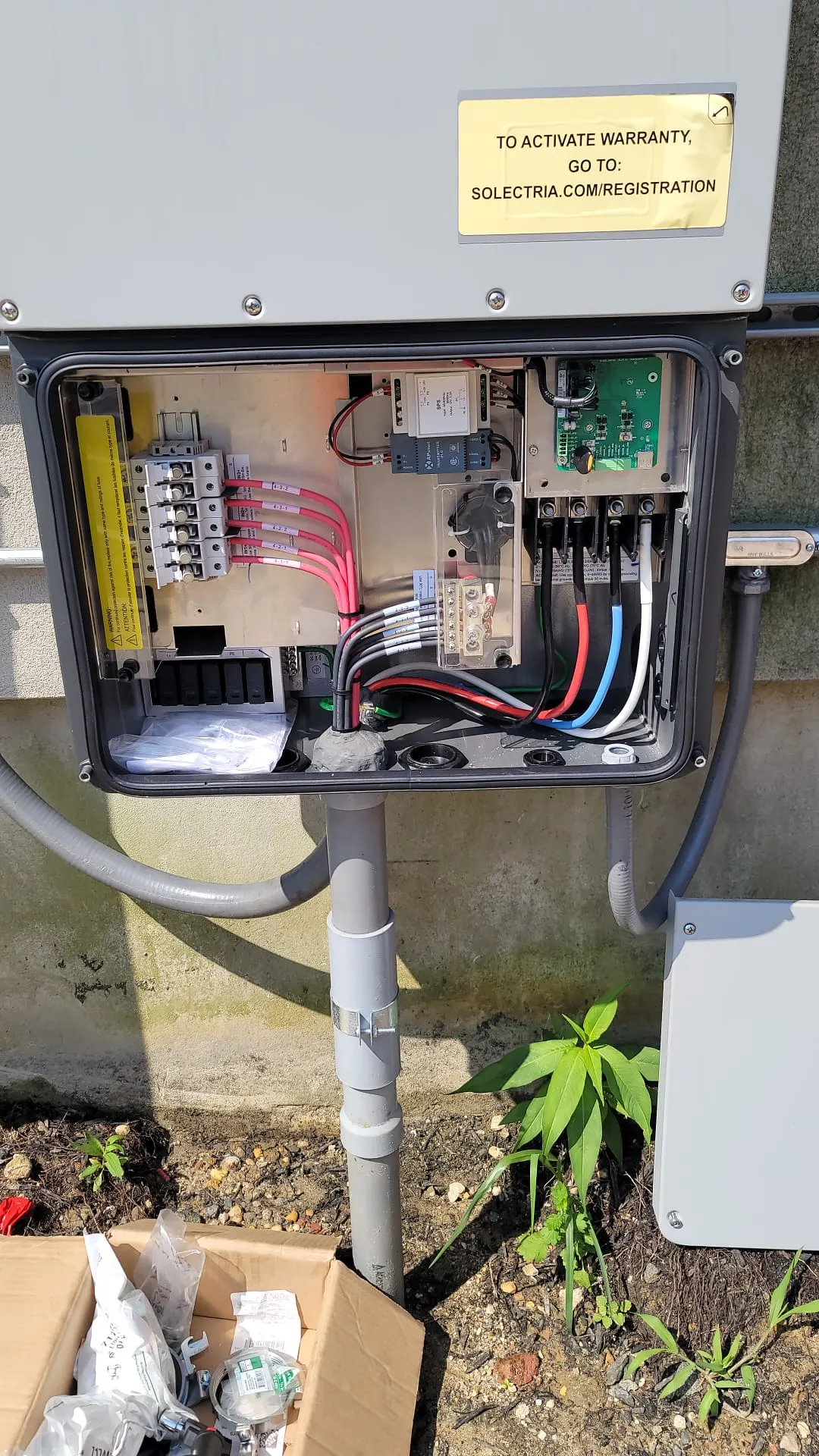 Solectria string inverter opened for inspection and commissioning